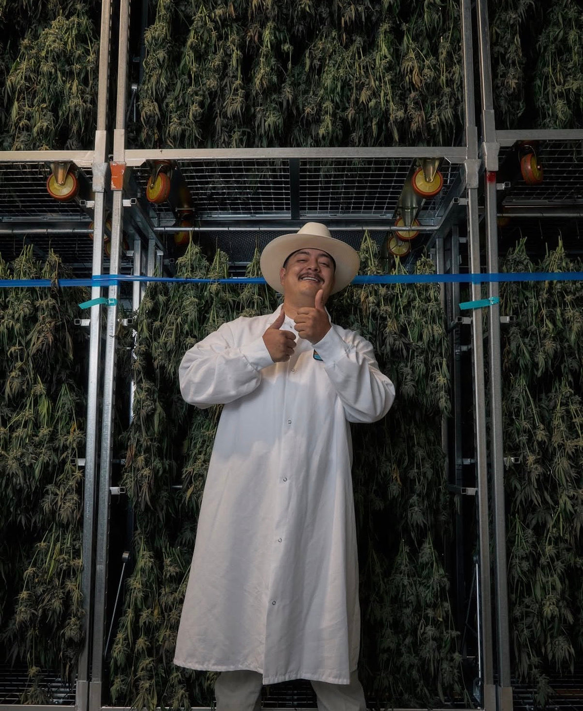 Friendly Farms grower in the flower drying room
